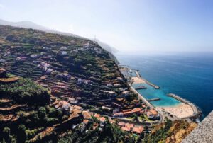 Artificial beach in Madeira. Madeira holiday destination views on the island landscape Artificial beach in Madeira. Madeira holiday destination views on the island landscape